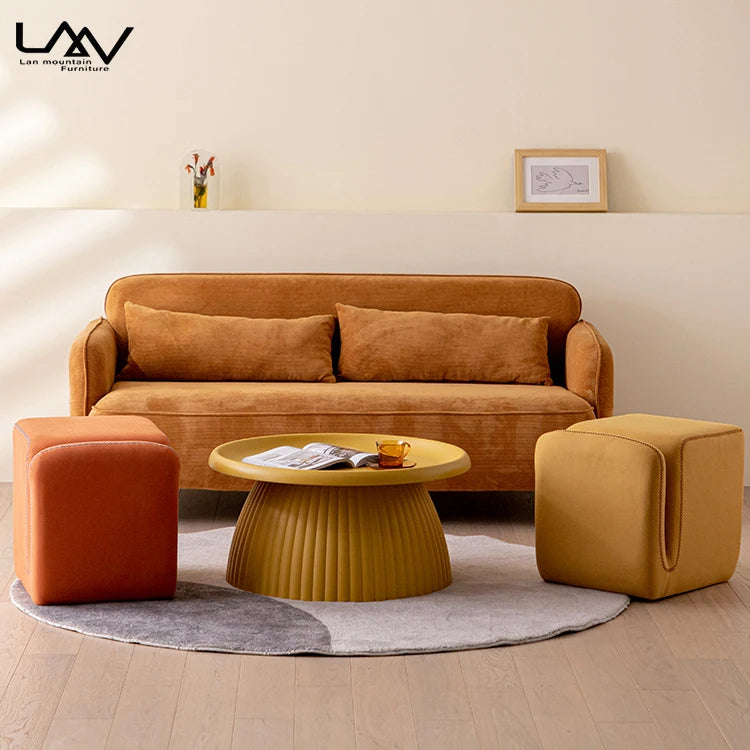 Modern Living Room Furniture: Orange & Yellow Foot Stools, Round Coffee Table, Sofa. Stylish Ottoman Seating.