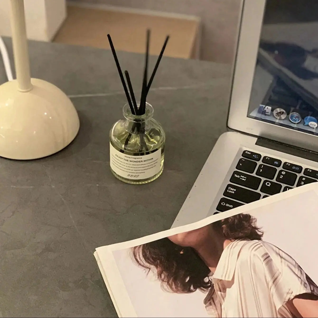 Workspace with Home Fragrance Diffuser: Laptop, Lamp, & Relaxing Desk Setup